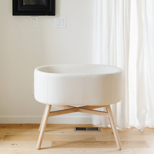 M26834GYLB,Babyletto,babyletto x GATHRE Capsule Bassinet in Ivory