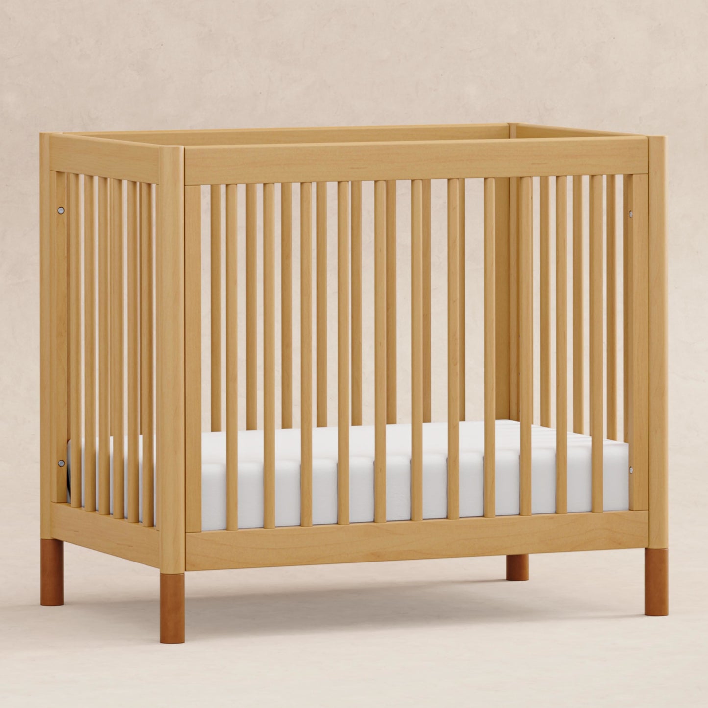 Gelato 4-in-1 Convertible Mini Crib and Twin bed in Natural Walnut Finish with Gold Feet
